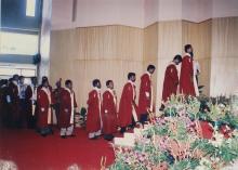 Graduates line up by the stage at the Student Activities Centre (SAC) to receive their degrees at the 39th Convocation, 2002