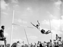 Pole vault event in progress during the Third Inter-IIT Sports Meet, 1964