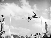 Pole vault event in progress during the Third Inter-IIT Sports Meet, 1964